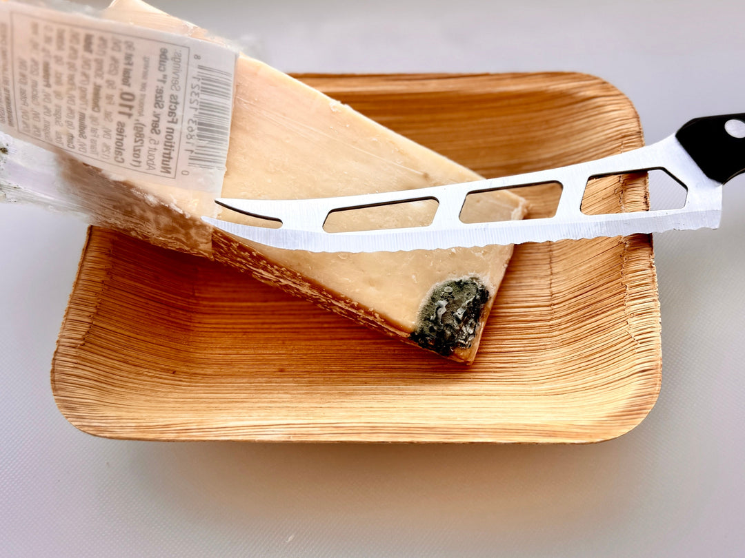 Parmesan Wedge with visible mold and cheese knife